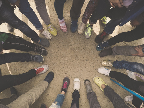 Group of People Standing on Pavement